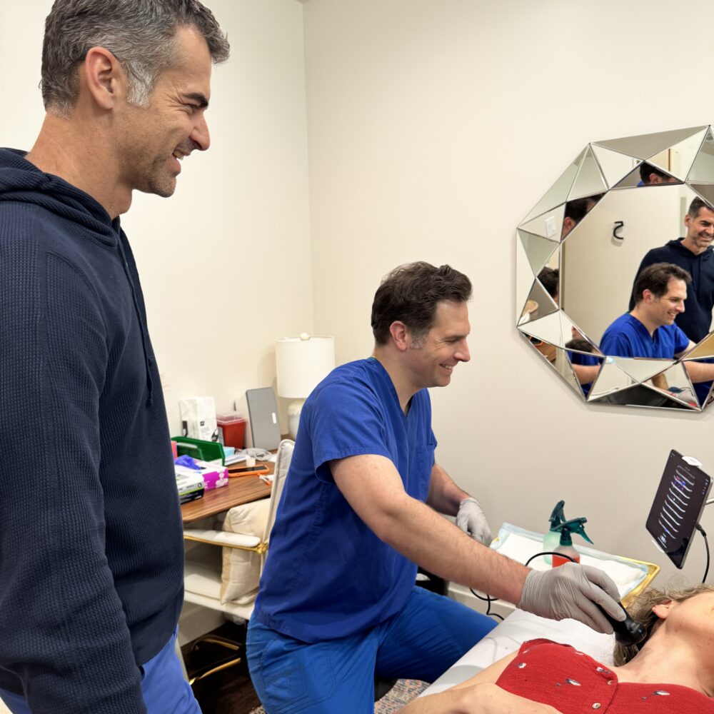 physician scans a patient's neck